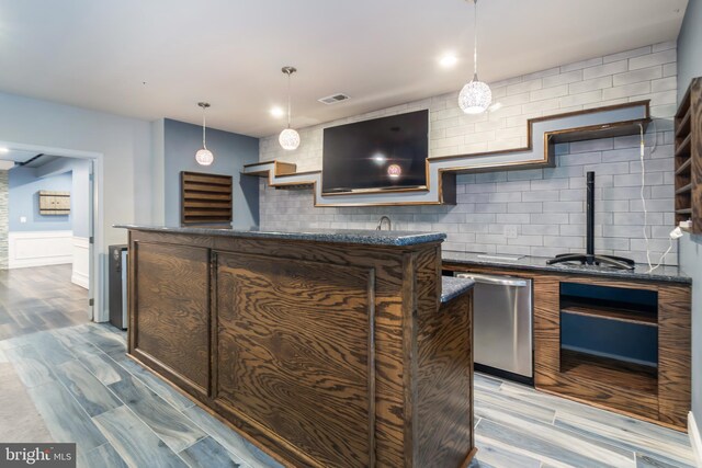 8266 Saint Francis Dr, Severn, MD 21144 - bar with stainless steel dishwasher, light wood-type flooring, decorative backsplash, a wainscoted wall, and hanging light fixtures