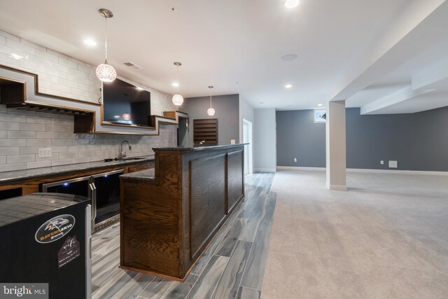 8266 Saint Francis Dr, Severn, MD 21144 - kitchen featuring dark countertops, tasteful backsplash, open floor plan, decorative light fixtures, and recessed lighting