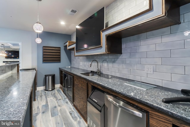 8266 Saint Francis Dr, Severn, MD 21144 - kitchen with dishwasher, tasteful backsplash, pendant lighting, and dark stone countertops