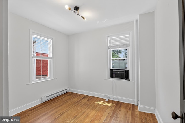 117 Pearl St, Lancaster, PA 17603 - spare room featuring a baseboard radiator, cooling unit, and light wood finished floors