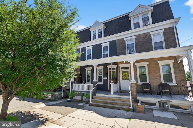 117 Pearl St, Lancaster, PA 17603 - view of front of property with a porch, roof with shingles, mansard roof, and brick siding