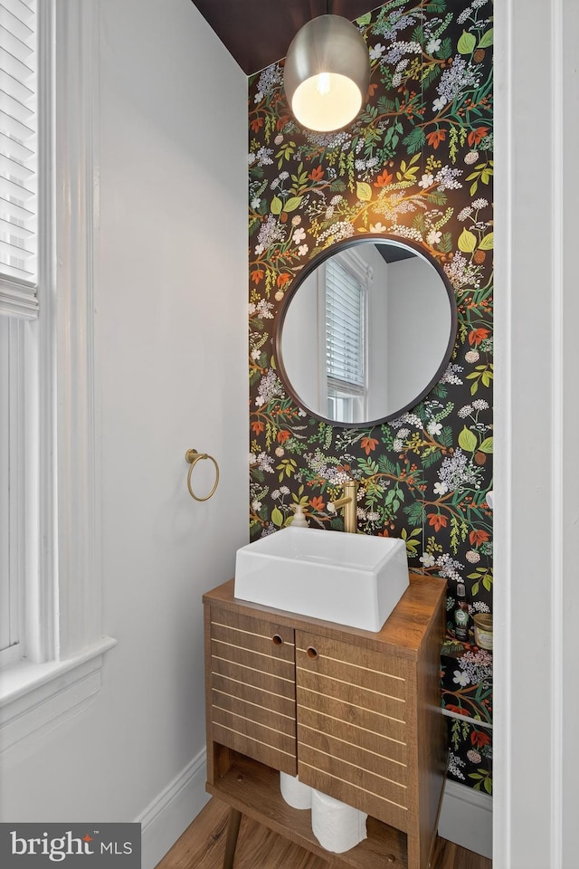 117 Pearl St, Lancaster, PA 17603 - bathroom featuring wallpapered walls, wood finished floors, and vanity