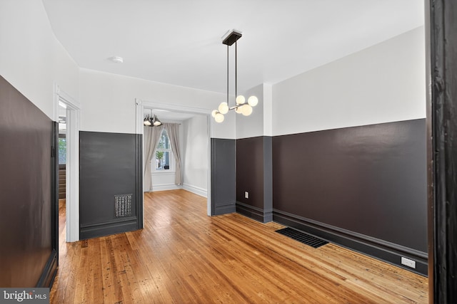 117 Pearl St, Lancaster, PA 17603 - spare room with a chandelier, hardwood / wood-style flooring, and a smoke detector