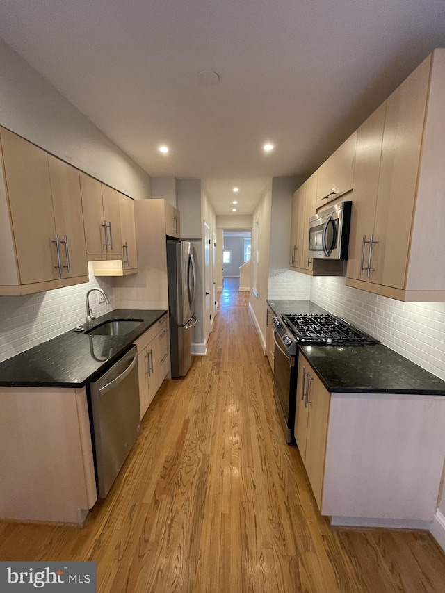 1423 T St NW, Washington, DC 20009 - kitchen with appliances with stainless steel finishes, light wood finished floors, tasteful backsplash, and recessed lighting