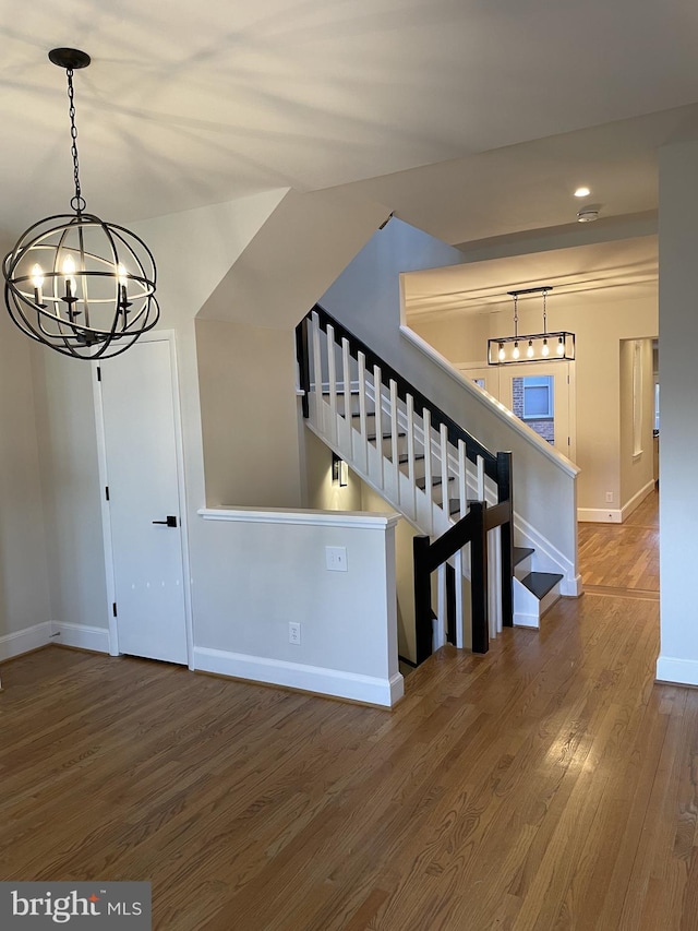 1423 T St NW, Washington, DC 20009 - stairway with a chandelier, wood finished floors, and recessed lighting