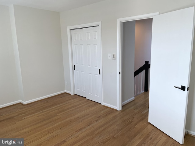 1423 T St NW, Washington, DC 20009 - unfurnished bedroom with light wood finished floors and a closet