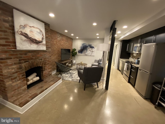 1423 T St NW, Washington, DC 20009 - living area featuring finished concrete flooring, recessed lighting, and a brick fireplace