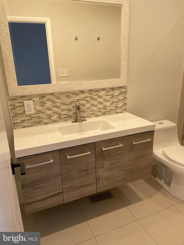 1423 T St NW, Washington, DC 20009 - bathroom with vanity, decorative backsplash, and tile patterned flooring