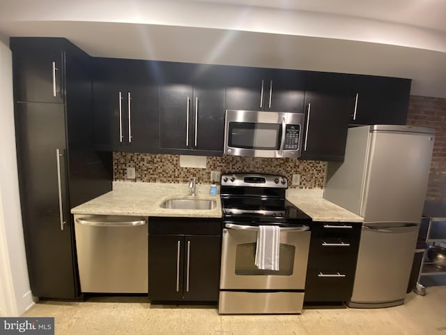 1423 T St NW, Washington, DC 20009 - kitchen featuring stainless steel appliances, dark cabinetry, and decorative backsplash