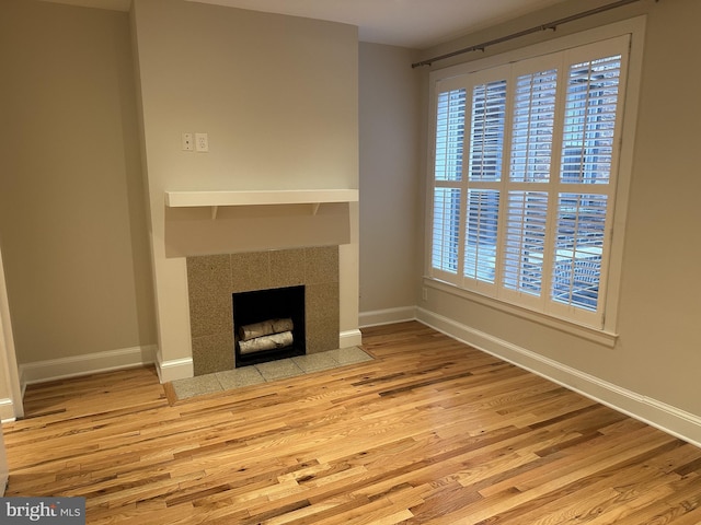 1423 T St NW, Washington, DC 20009 - unfurnished living room featuring wood finished floors and a fireplace