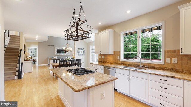 24 Montfort Dr, Belle Mead, NJ 08502 - kitchen featuring appliances with stainless steel finishes, a center island, white cabinets, light wood-style flooring, and recessed lighting