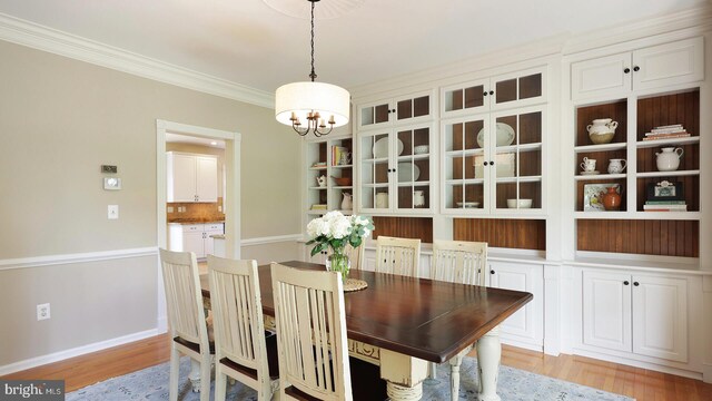 24 Montfort Dr, Belle Mead, NJ 08502 - dining room with a chandelier, light wood-type flooring, and crown molding