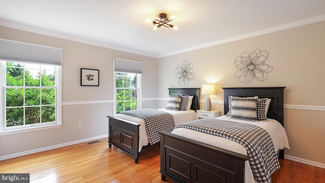 24 Montfort Dr, Belle Mead, NJ 08502 - bedroom with light wood-style flooring and ornamental molding