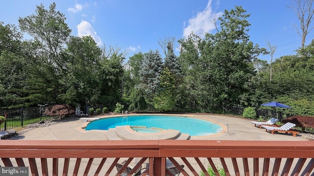 24 Montfort Dr, Belle Mead, NJ 08502 - view of pool with a patio area, view of wooded area, a pool with connected hot tub, and a diving board