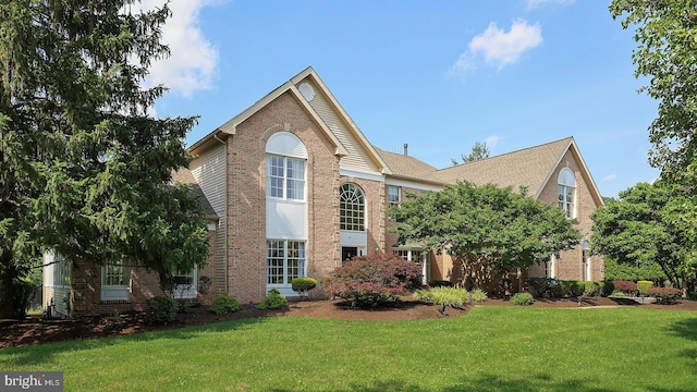 24 Montfort Dr, Belle Mead, NJ 08502 - traditional home with brick siding and a front yard