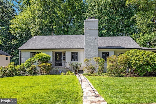 5124 37th St N, Arlington, VA 22207 - view of front of property with brick siding, a chimney, a front yard, and a shingled roof