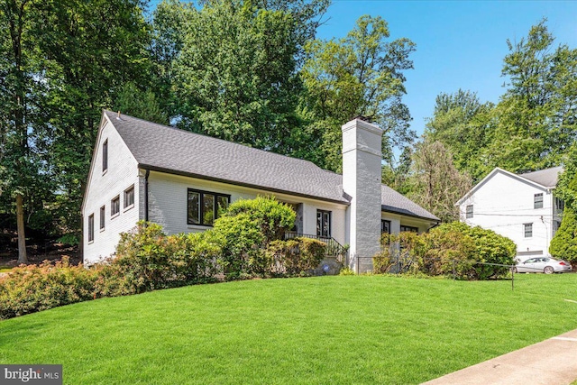 5124 37th St N, Arlington, VA 22207 - view of front of house featuring a chimney, a front yard, and a shingled roof