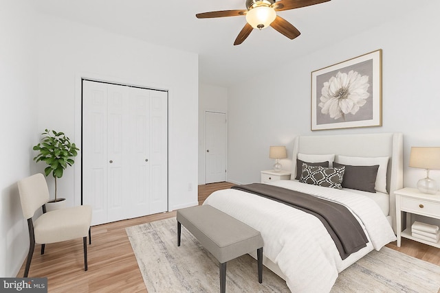 1804 E Lafayette Ave, Baltimore, MD 21213 - bedroom with a closet, light wood-type flooring, and a ceiling fan
