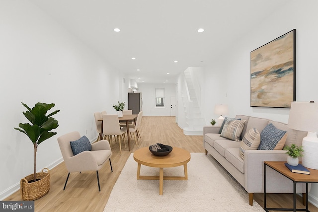 1804 E Lafayette Ave, Baltimore, MD 21213 - living area with light wood finished floors, recessed lighting, and stairway