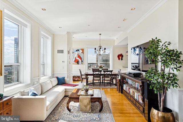 1425 Locust St Unit 33A, Philadelphia, PA 19102 - living room with light wood-type flooring, wainscoting, a chandelier, crown molding, and recessed lighting