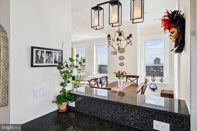 1425 Locust St Unit 33A, Philadelphia, PA 19102 - kitchen featuring crown molding, a chandelier, and dark stone counters