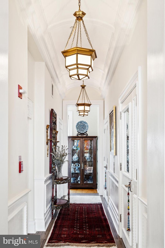 1425 Locust St Unit 33A, Philadelphia, PA 19102 - entrance foyer with wood finished floors, a chandelier, ornamental molding, and lofted ceiling