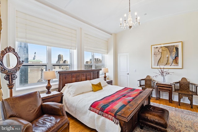 1425 Locust St Unit 33A, Philadelphia, PA 19102 - bedroom with a chandelier, wood finished floors, and a view of city