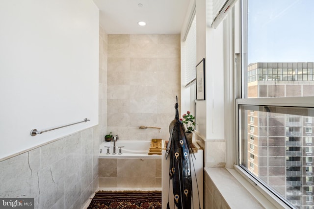 1425 Locust St Unit 33A, Philadelphia, PA 19102 - bathroom featuring tile walls and a garden tub