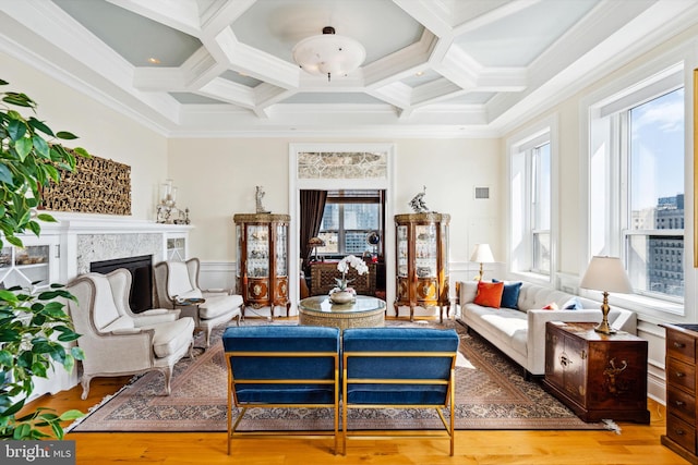 1425 Locust St Unit 33A, Philadelphia, PA 19102 - living area featuring coffered ceiling, crown molding, a wainscoted wall, a fireplace, and beamed ceiling