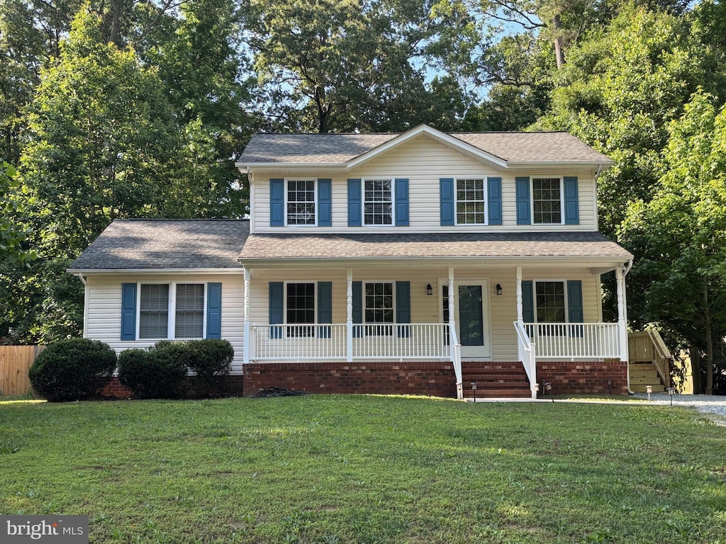 218 Hamilton Dr, Ruther Glen, VA 22546 - view of front of property with covered porch and a front lawn