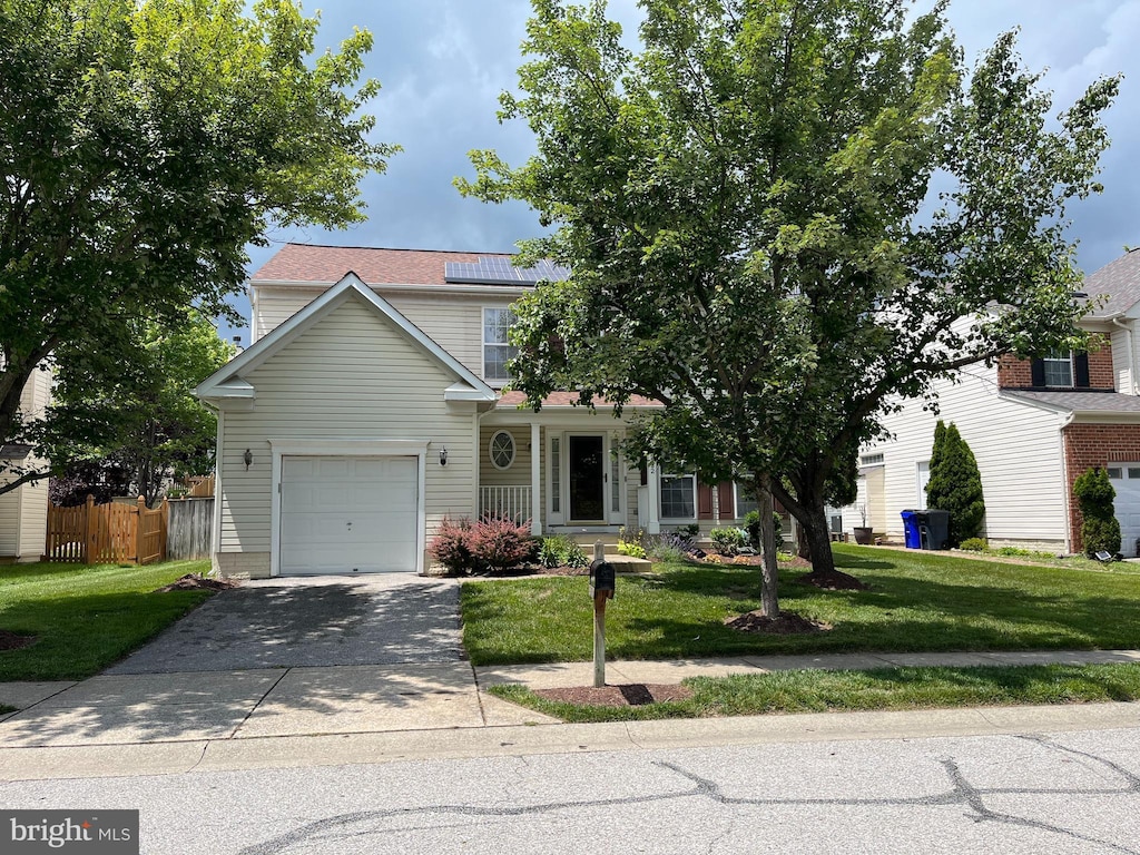 9532 Chaton Rd, Laurel, MD 20723 - view of front of home featuring concrete driveway and roof mounted solar panels