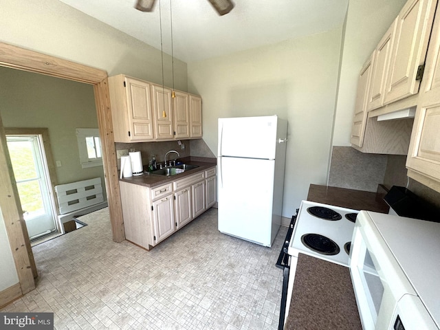 505 W 5th St, Lewistown, PA 17044 - kitchen with white appliances, dark countertops, tasteful backsplash, and ceiling fan