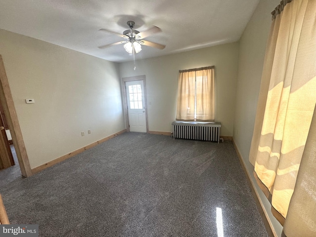 505 W 5th St, Lewistown, PA 17044 - empty room with radiator heating unit, a ceiling fan, and carpet