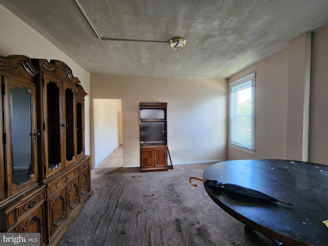 1226 Bloomingdale Rd, Baltimore, MD 21216 - carpeted dining area featuring baseboards and a textured ceiling