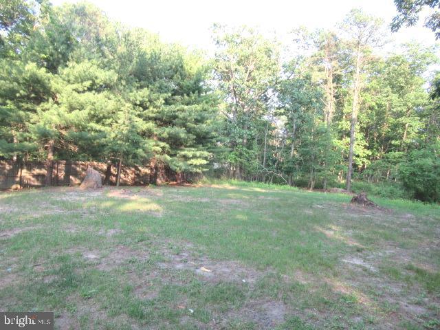 830 Jarvis Rd, Sicklerville, NJ 08081 - view of grassy yard featuring a wooded view