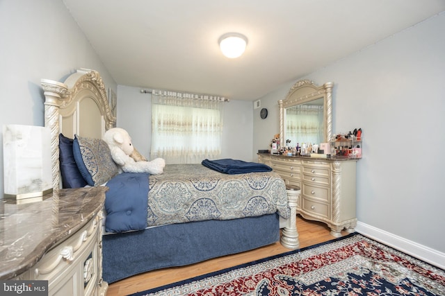 7093 Spring Garden Dr Unit 202, Springfield, VA 22150 - bedroom featuring light wood-style floors and multiple windows