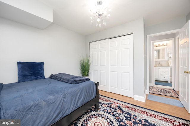 7093 Spring Garden Dr Unit 202, Springfield, VA 22150 - bedroom with a chandelier, light wood-style floors, and a closet