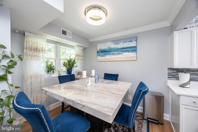 7093 Spring Garden Dr Unit 202, Springfield, VA 22150 - dining area featuring crown molding and wood finished floors