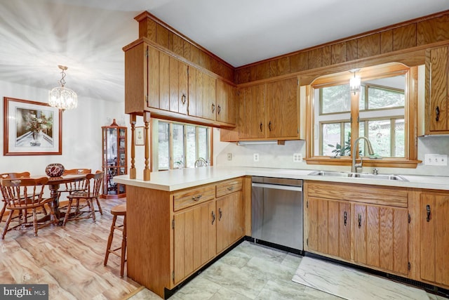 331 Spring Garden St, Ephrata, PA 17522 - kitchen with dishwasher, a peninsula, light countertops, and a chandelier