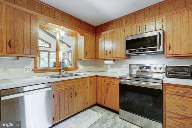 331 Spring Garden St, Ephrata, PA 17522 - kitchen featuring stainless steel appliances, light countertops, and brown cabinetry