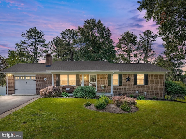 117 Amherst Ct, Stephens City, VA 22655 - ranch-style home featuring brick siding, a front lawn, driveway, and an attached garage