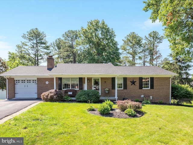 117 Amherst Ct, Stephens City, VA 22655 - single story home with an attached garage, asphalt driveway, a front lawn, brick siding, and a chimney
