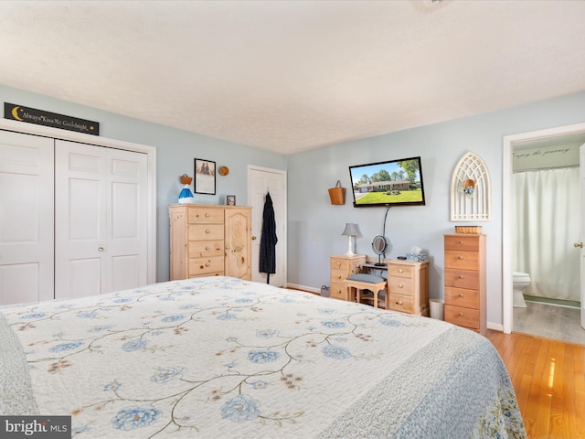 117 Amherst Ct, Stephens City, VA 22655 - bedroom with light wood-style floors, two closets, and ensuite bathroom