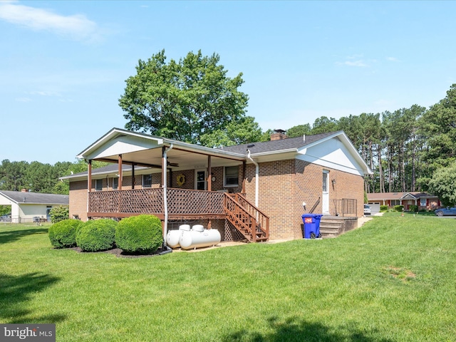117 Amherst Ct, Stephens City, VA 22655 - rear view of house featuring ceiling fan, brick siding, a yard, and a chimney