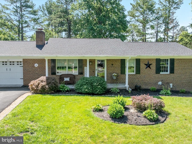 117 Amherst Ct, Stephens City, VA 22655 - ranch-style home with a garage, brick siding, a front lawn, and covered porch