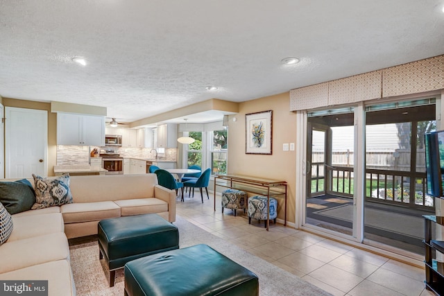 20304 Watkins Meadow Dr, Germantown, MD 20876 - living room featuring light tile patterned floors, a textured ceiling, recessed lighting, and ceiling fan