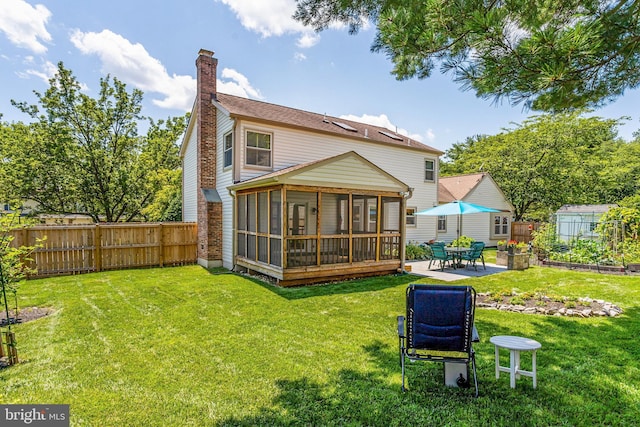 20304 Watkins Meadow Dr, Germantown, MD 20876 - back of property with a sunroom, a chimney, a fenced backyard, and a patio area