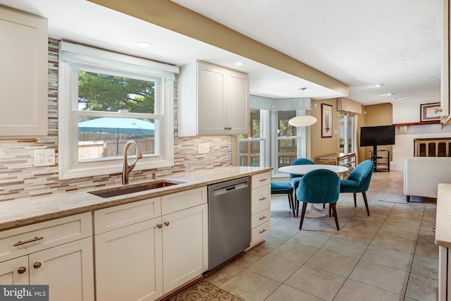 20304 Watkins Meadow Dr, Germantown, MD 20876 - kitchen featuring stainless steel dishwasher, backsplash, light tile patterned floors, recessed lighting, and hanging light fixtures