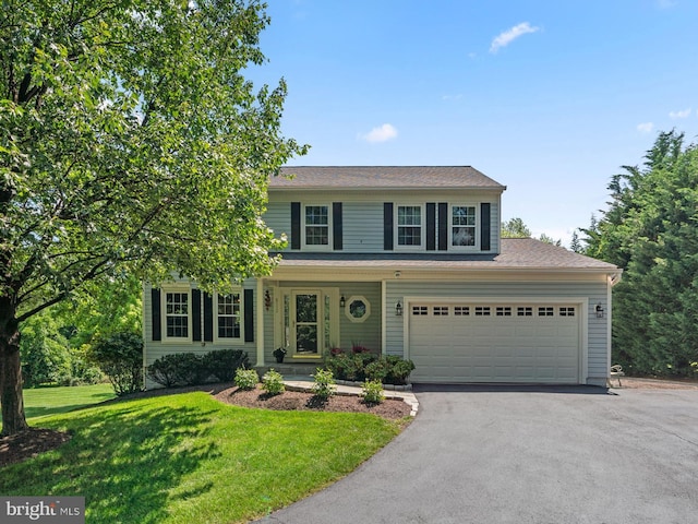8112 Elsies Way, Laurel, MD 20723 - view of front facade with asphalt driveway and a front lawn