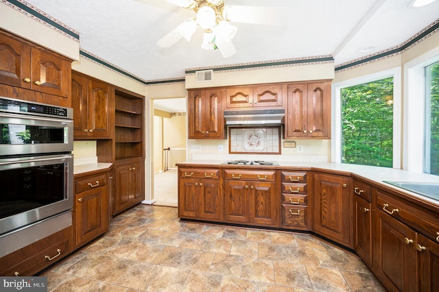 5599 Small Oak Ct, Woodbridge, VA 22192 - kitchen with stainless steel double oven, light countertops, under cabinet range hood, a ceiling fan, and open shelves